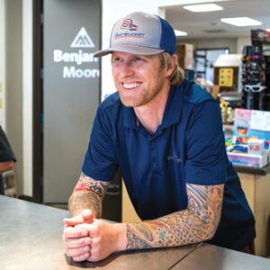 Paint store employee at counter